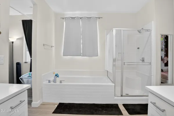 a bathroom with a bathtub and a sink