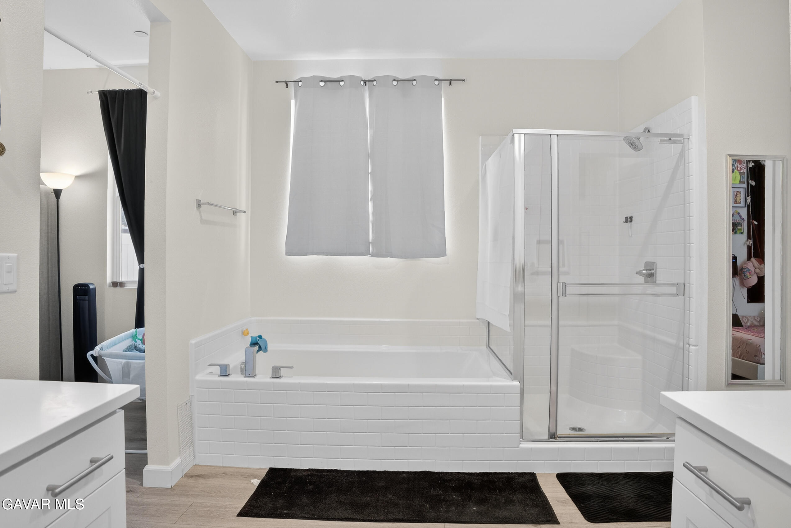 38018 Periwinkle Place Palmdale, CA 93550 - Photo 16 of 32 a bathroom with a bathtub and a sink