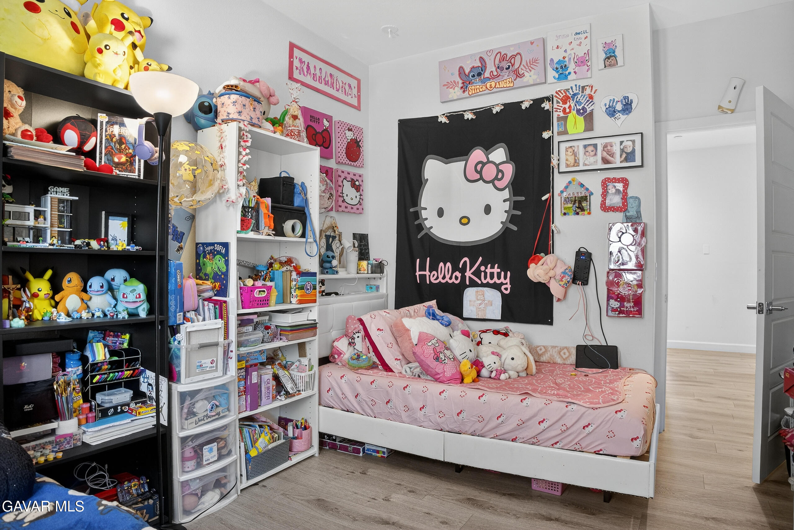 38018 Periwinkle Place Palmdale, CA 93550 - Photo 18 of 32 a bedroom with baby toys and a book shelf