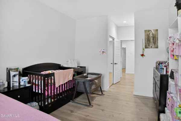 a bedroom with furniture and a dresser