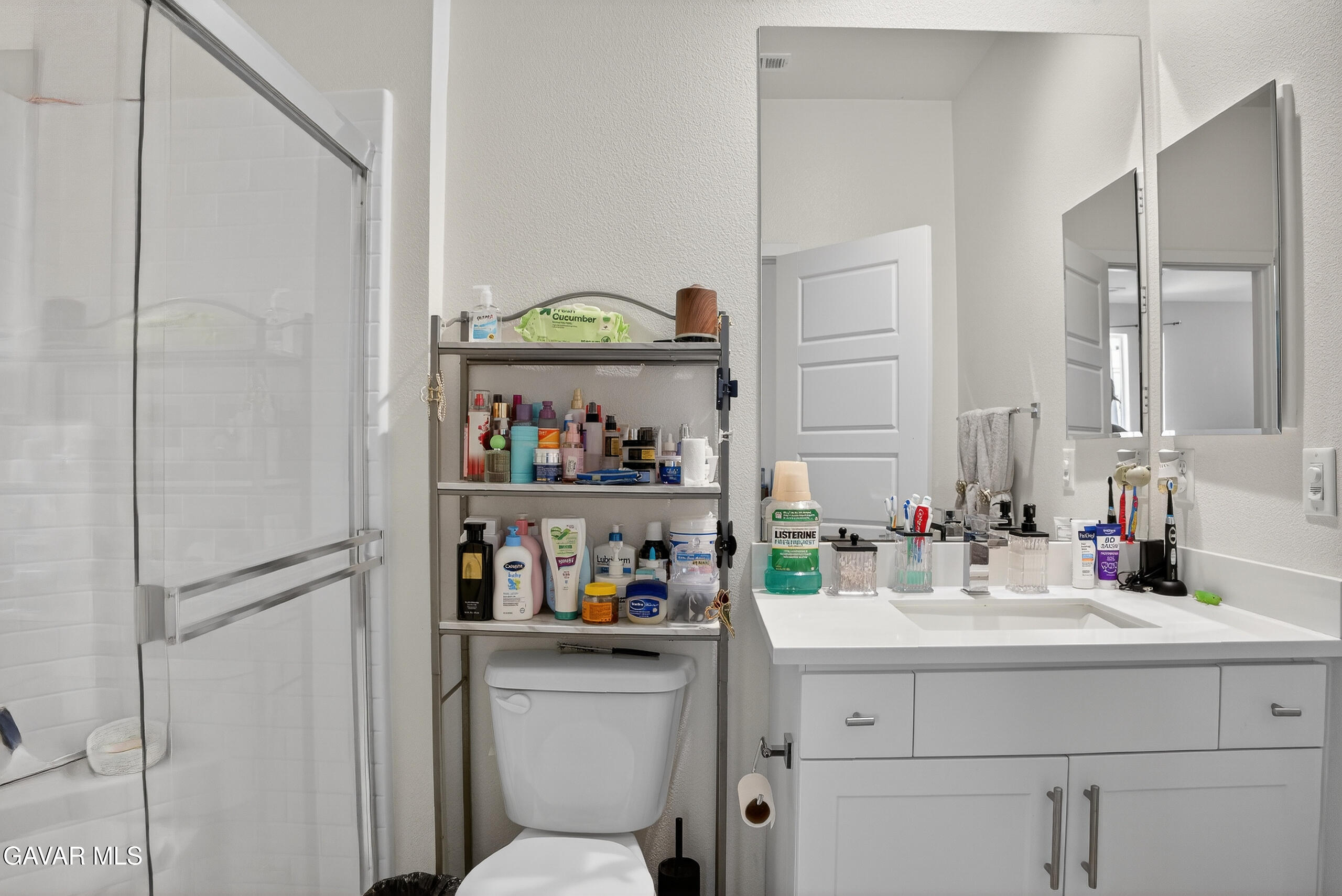 38018 Periwinkle Place Palmdale, CA 93550 - Photo 28 of 32 a bathroom with a sink a toilet and a mirror