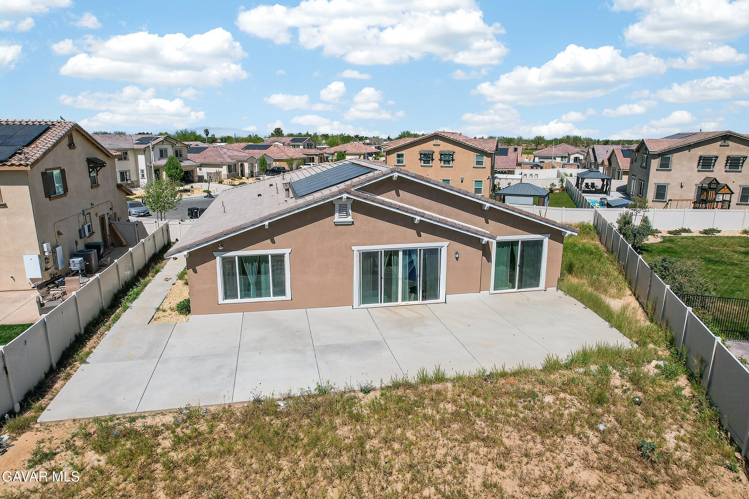 38018 Periwinkle Place Palmdale, CA 93550 - Photo 29 of 32 a view of a house with a roof deck
