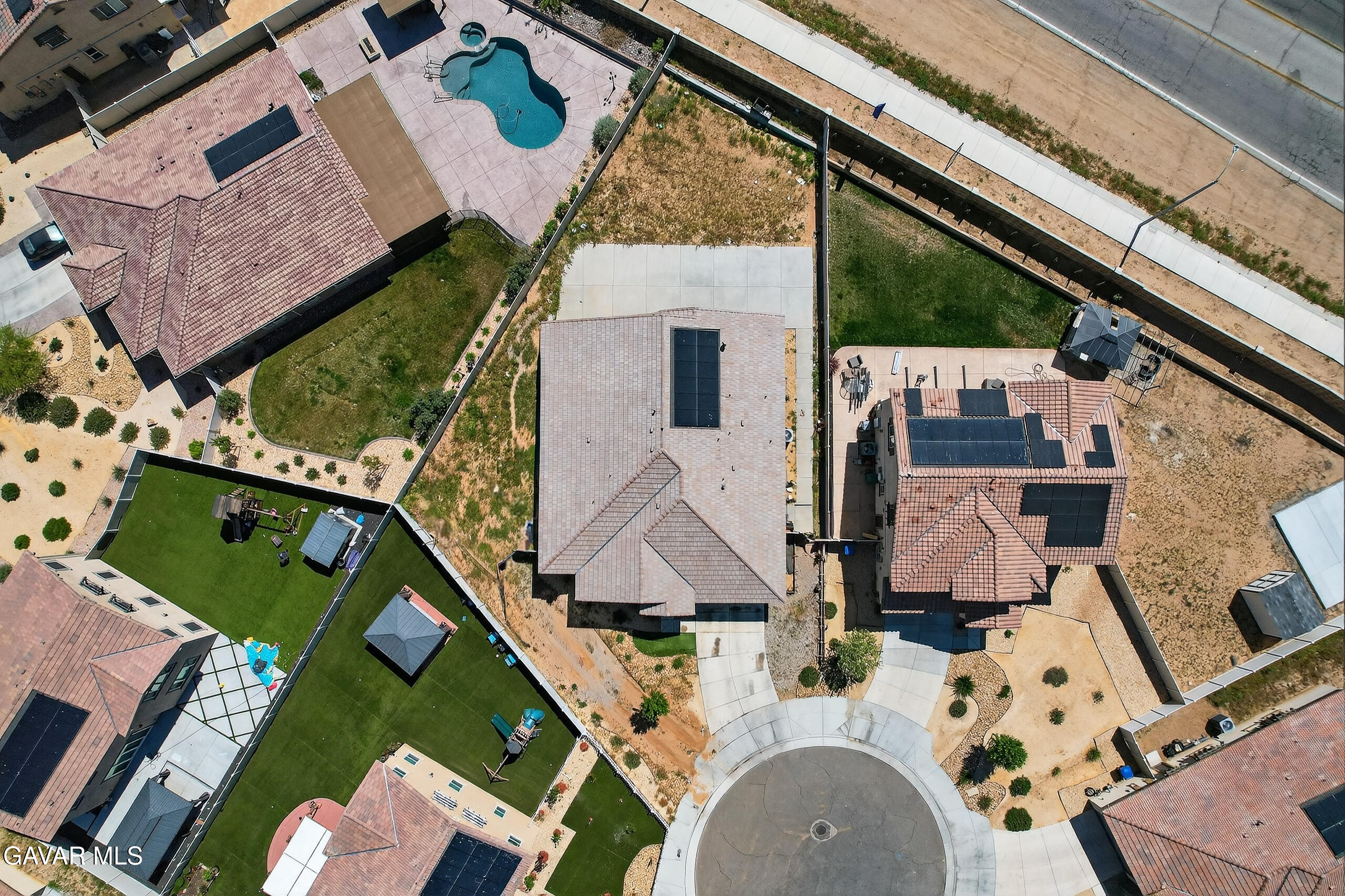38018 Periwinkle Place Palmdale, CA 93550 - Photo 31 of 32 an aerial view of house with a swimming pool
