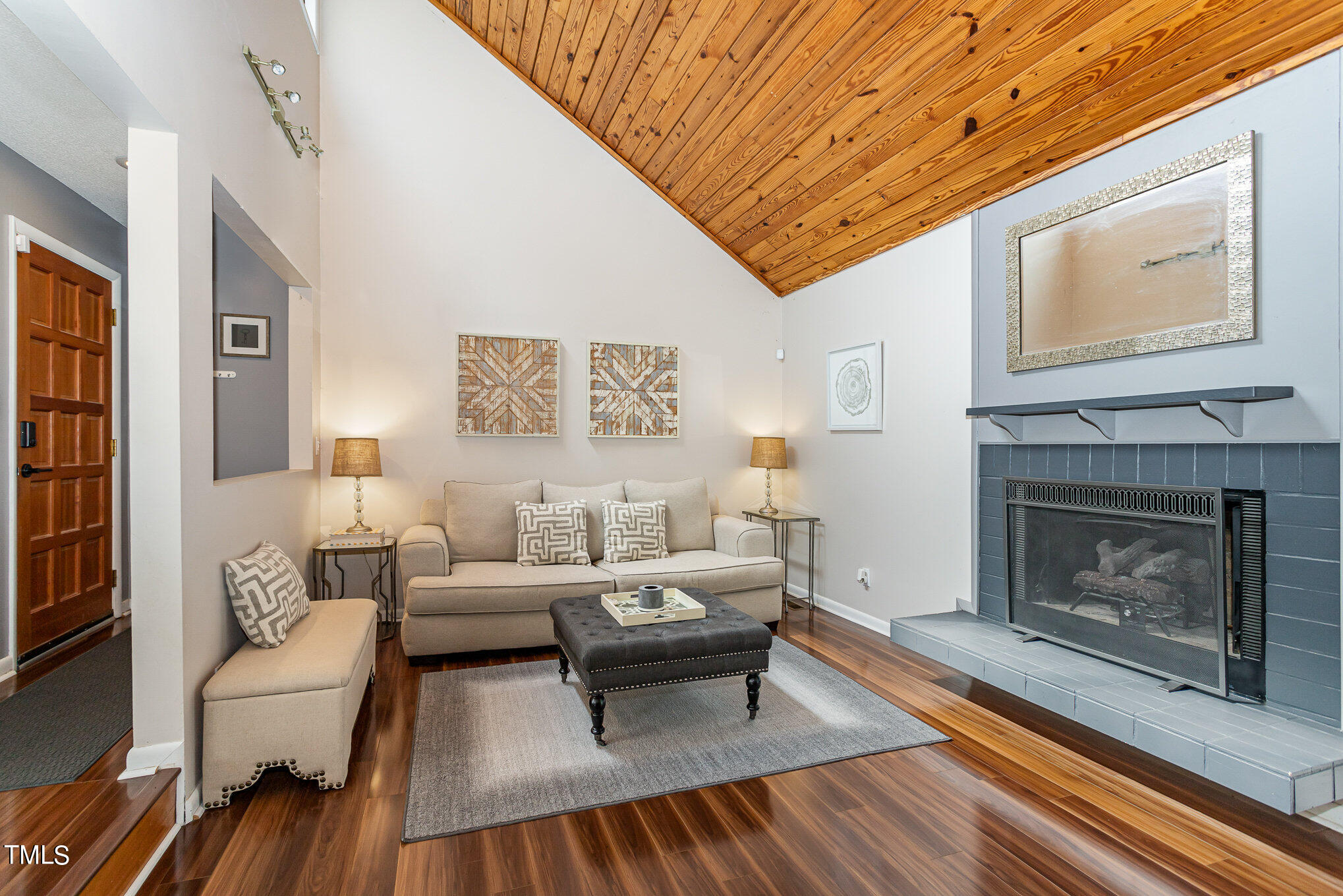 6913 Three Bridges Circle Raleigh, NC 27613 - Photo 7 of 28 a living room with furniture and a fireplace