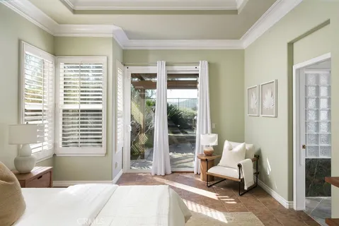 a bedroom with furniture and a window