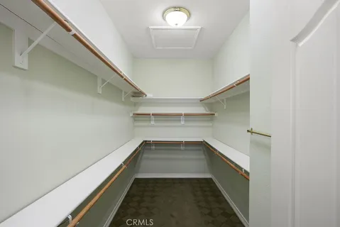 a bathroom with a double vanity sink mirror and shower