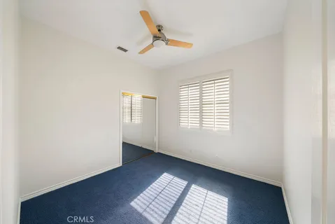 a view of a storage and utility room with washer and dryer