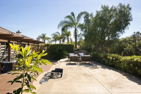 a view of a patio with a dining table chairs and iron floor