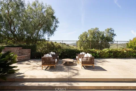 a wooden bench sitting in backside of a house