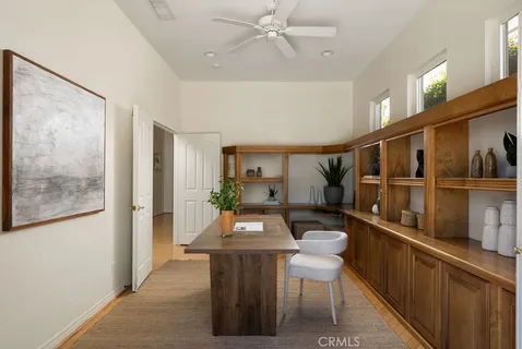 a view of a hallway with furniture and window