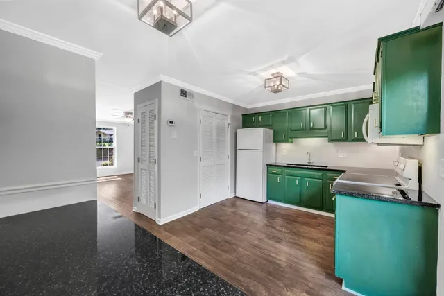a kitchen with stainless steel appliances a refrigerator and a sink