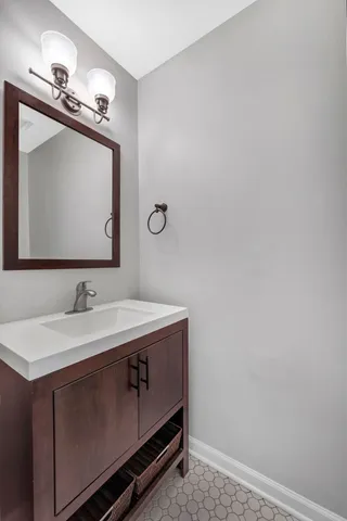 a bathroom with a sink and a mirror