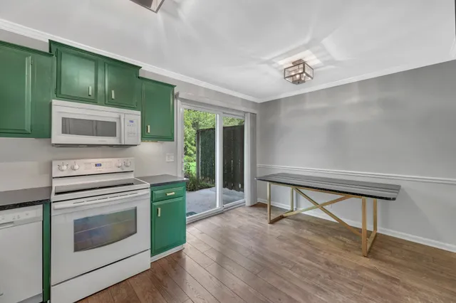 a kitchen with a stove and a microwave