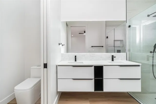 a view of bathroom with a sink and mirror
