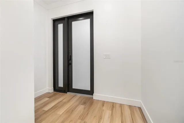 a view of an empty room with closet