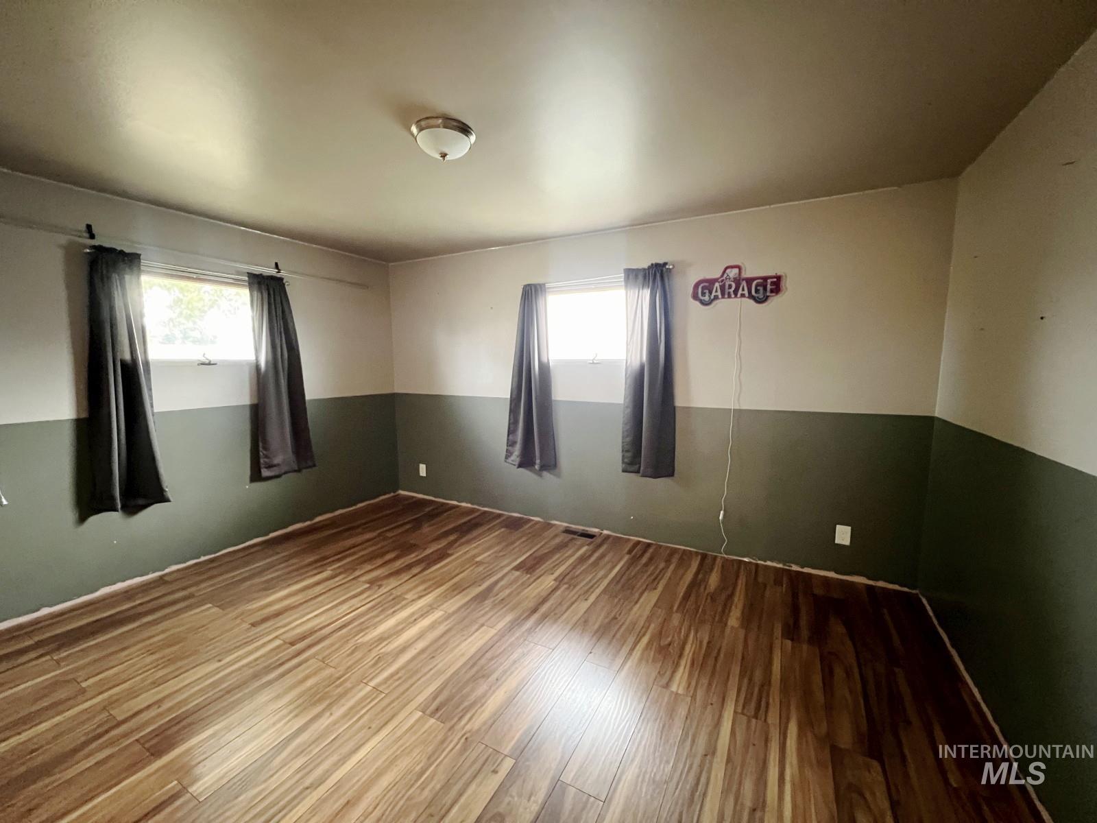 603 Maple Street Nezperce, ID 83543 - Photo 14 of 26 Spare room with wood finished floors