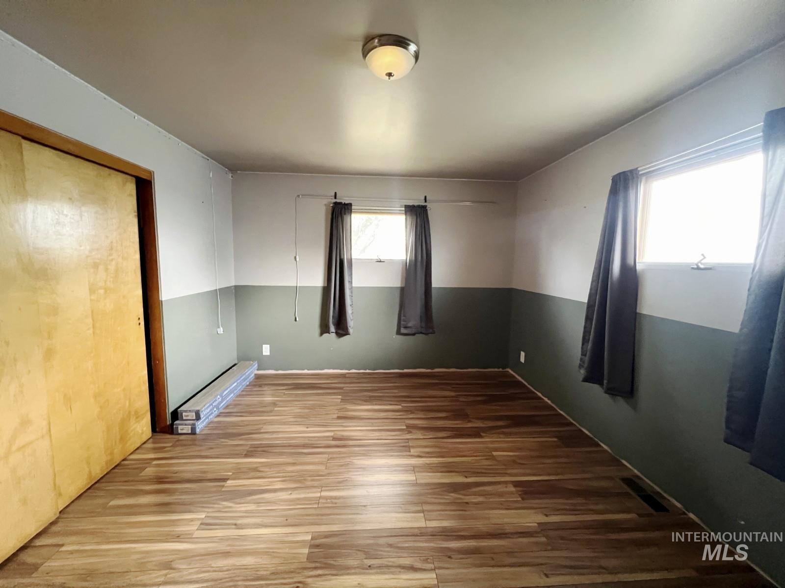 603 Maple Street Nezperce, ID 83543 - Photo 15 of 26 Unfurnished bedroom featuring wood finished floors and a closet