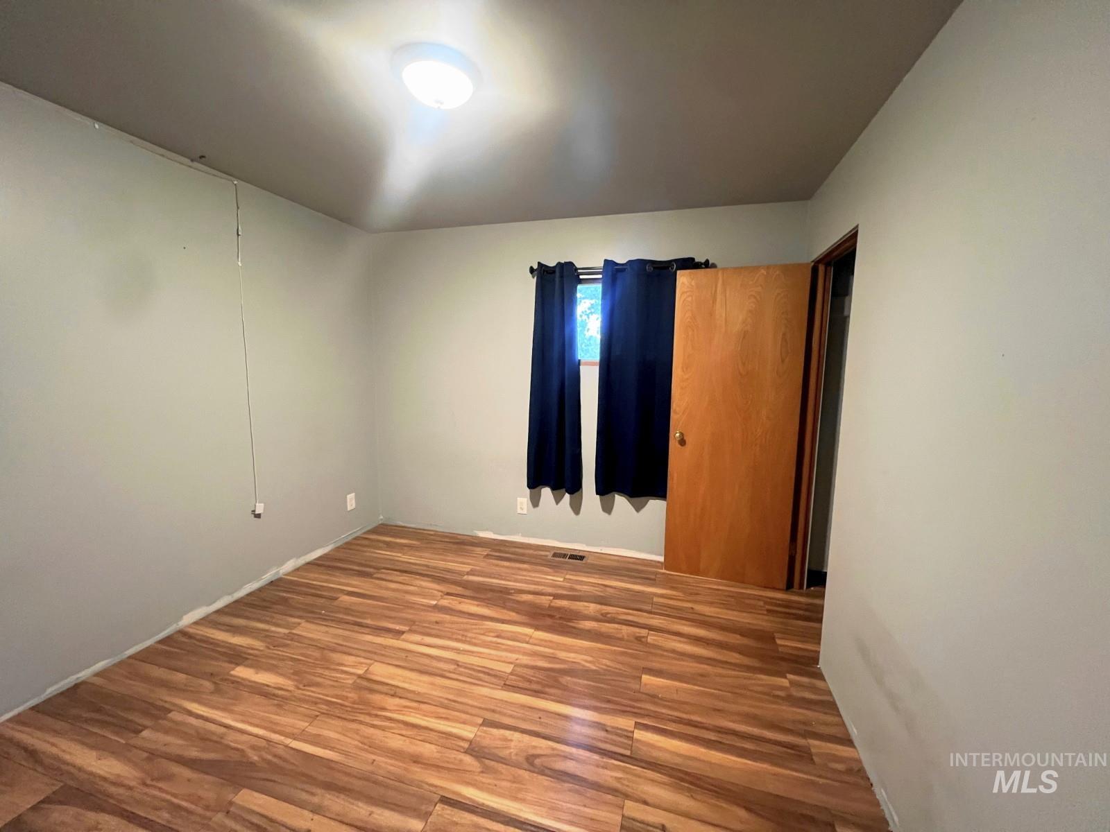 603 Maple Street Nezperce, ID 83543 - Photo 16 of 26 Unfurnished room featuring wood finished floors