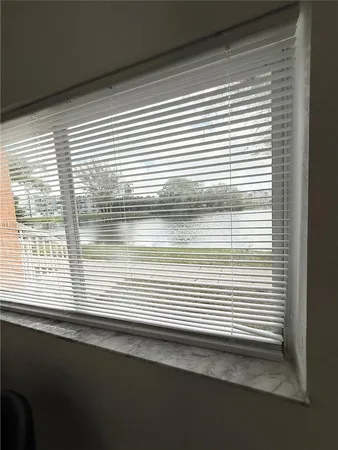 a view of a window and a kitchen