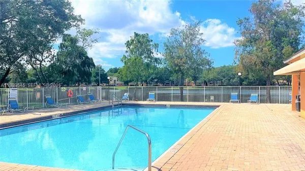 a view of a swimming pool with a lake view
