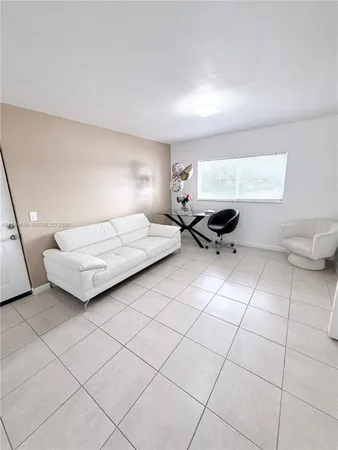 a bedroom with a bed and a night stand