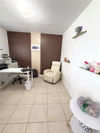 a living room with furniture and white walls