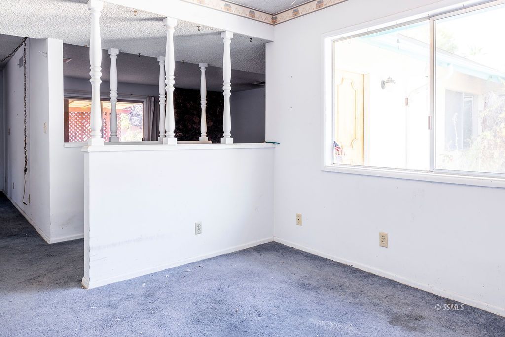 1243 Wayne Street Ridgecrest, CA 93555 - Photo 14 of 42 an empty room with a window