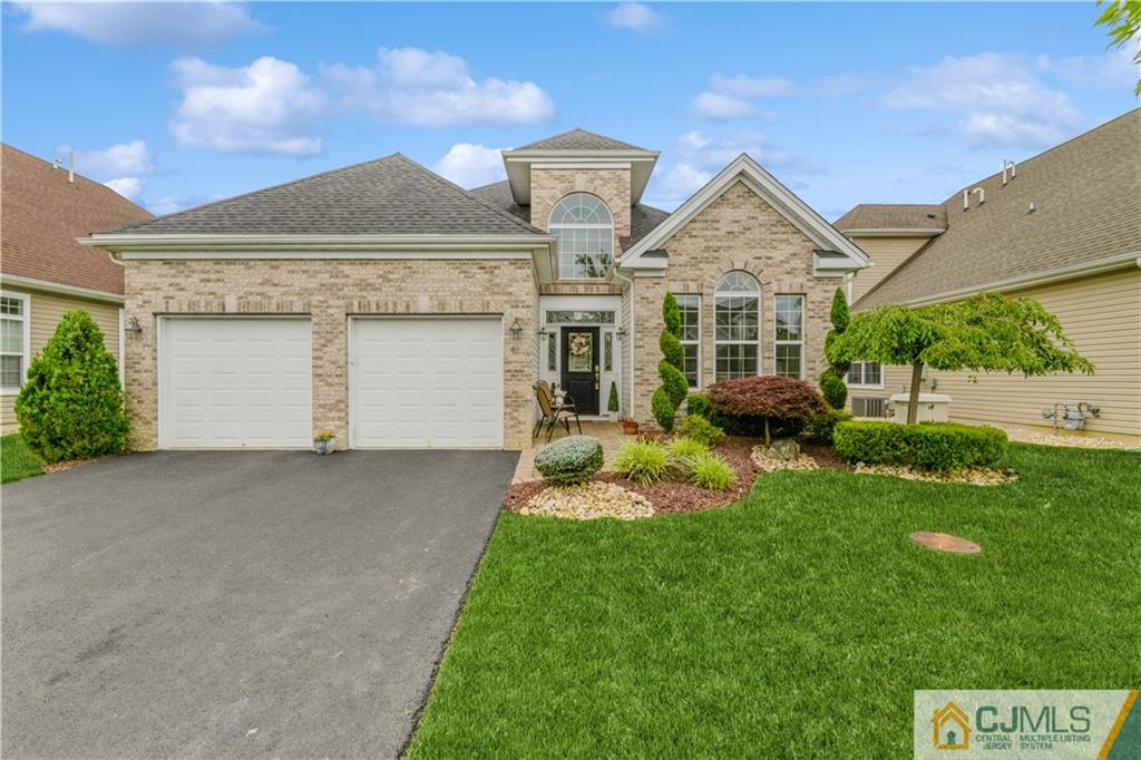 18 Mandrake Road Monroe Township, NJ 08831 - Photo 1 of 44 a front view of a house with a yard and garage