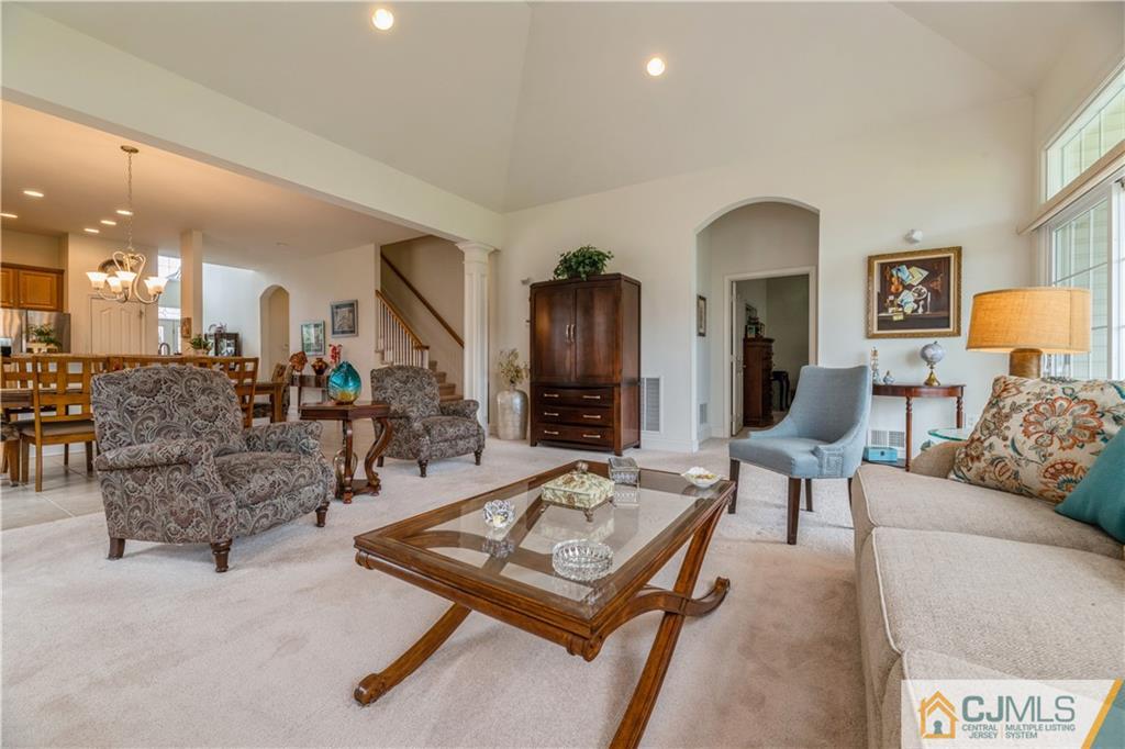 18 Mandrake Road Monroe Township, NJ 08831 - Photo 18 of 44 a living room with furniture and wooden floor
