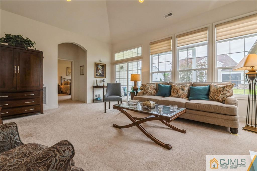 18 Mandrake Road Monroe Township, NJ 08831 - Photo 19 of 44 a living room with furniture and a flat screen tv