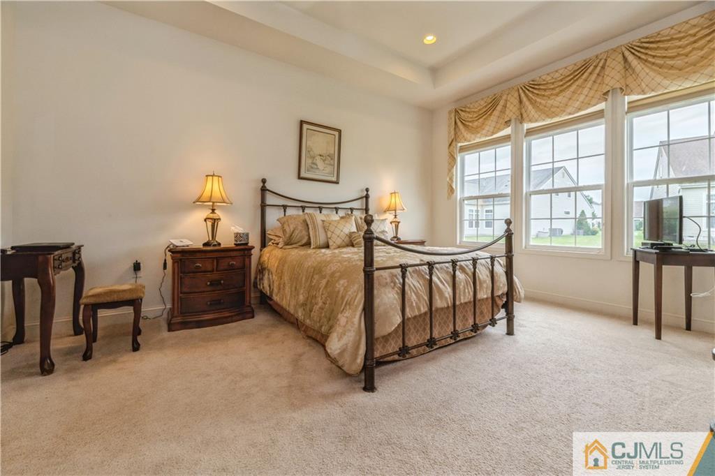 18 Mandrake Road Monroe Township, NJ 08831 - Photo 20 of 44 a bed sitting in a spacious bedroom next to a window