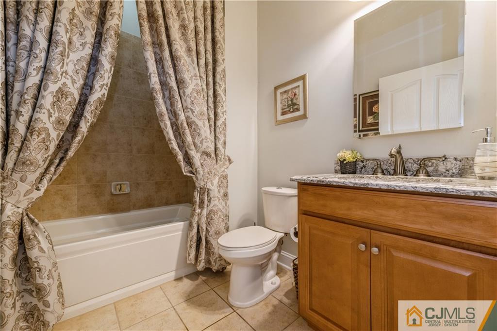 18 Mandrake Road Monroe Township, NJ 08831 - Photo 24 of 44 a bathroom with a granite countertop sink toilet and shower