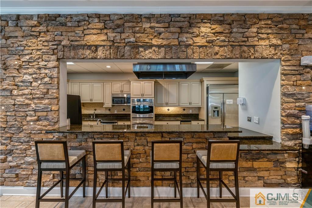 18 Mandrake Road Monroe Township, NJ 08831 - Photo 36 of 44 a kitchen with a sink and cabinets