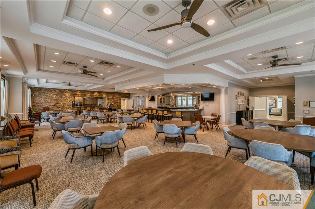 18 Mandrake Road Monroe Township, NJ 08831 - Photo 37 of 44 a living room with lots of furniture and a clock