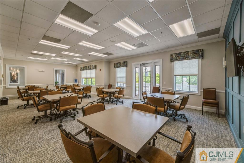 18 Mandrake Road Monroe Township, NJ 08831 - Photo 39 of 44 a living room with lots of furniture and a large window