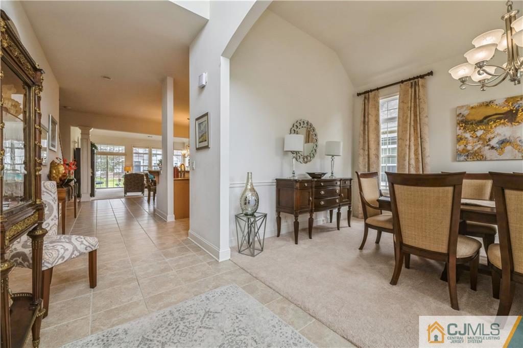 18 Mandrake Road Monroe Township, NJ 08831 - Photo 5 of 44 a view of a a dining room with furniture window and wooden floor