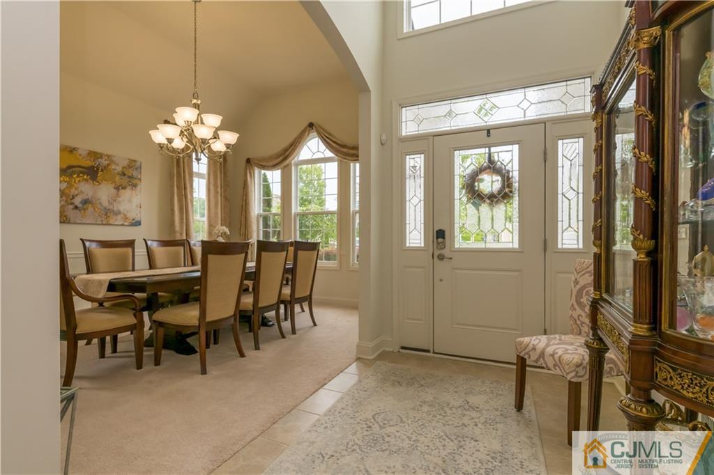 18 Mandrake Road Monroe Township, NJ 08831 - Photo 6 of 44 a view of a dining room with furniture and a chandelier