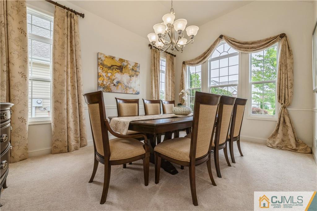 18 Mandrake Road Monroe Township, NJ 08831 - Photo 7 of 44 a view of a dining room with furniture window and outside view