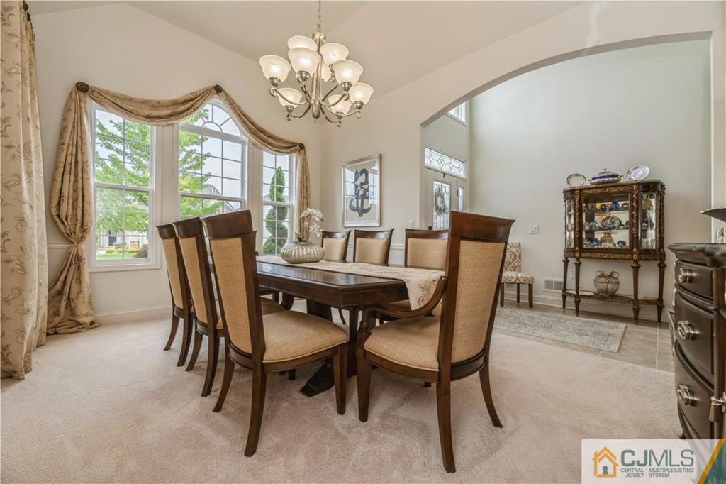 18 Mandrake Road Monroe Township, NJ 08831 - Photo 8 of 44 a view of a dining room with furniture window and outside view
