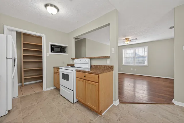 a kitchen with stainless steel appliances granite countertop a stove and a sink