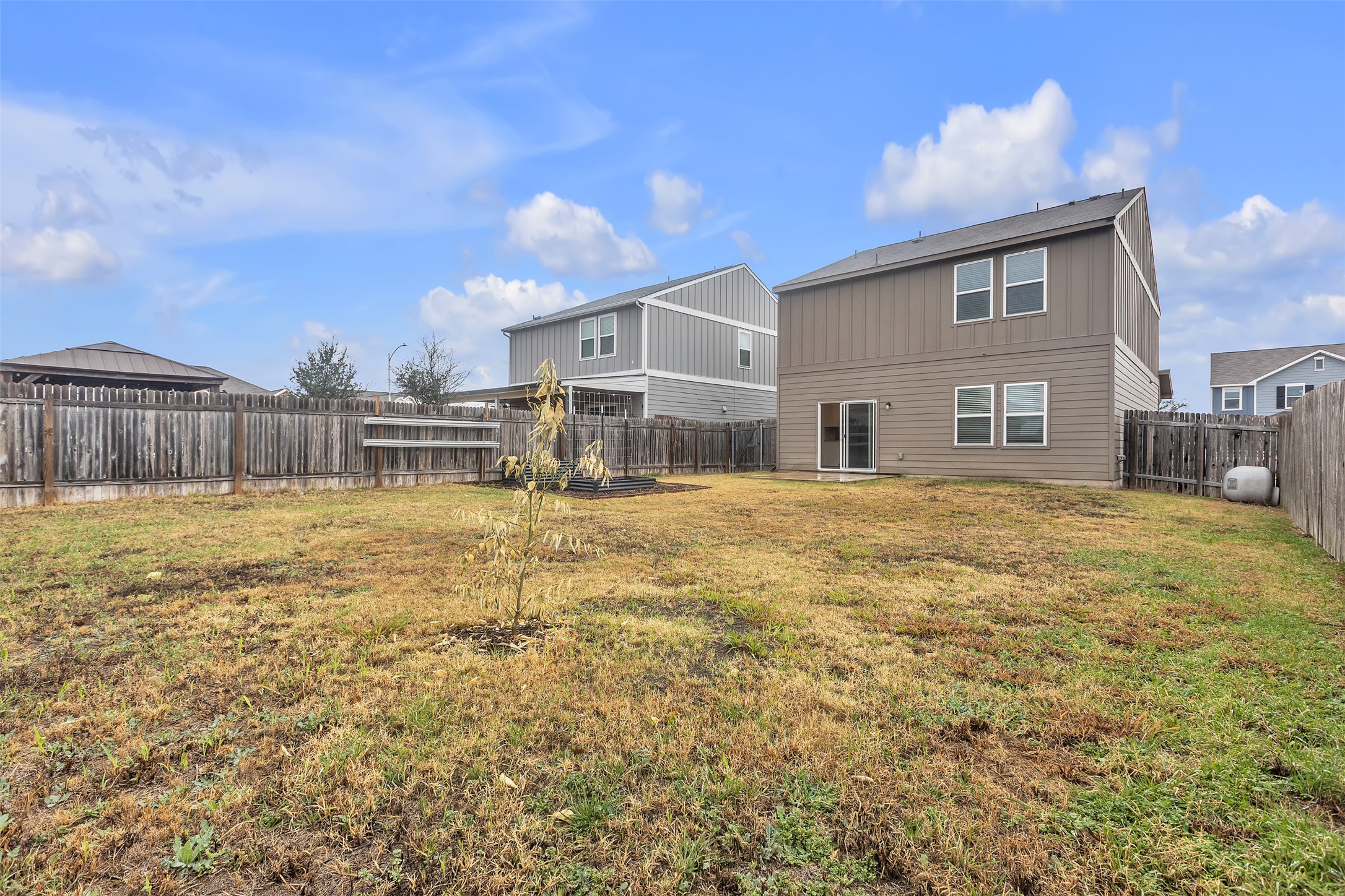 13014 Carswell Street Austin, TX 78754 - Photo 18 of 21 Back of property featuring a fenced backyard