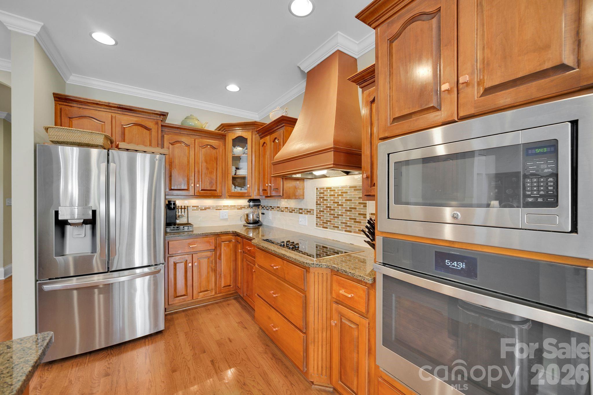 1171 State Rd S-29-376 Lancaster, SC 29720 - Photo 14 of 48 a kitchen with stainless steel appliances granite countertop a refrigerator a stove and a sink