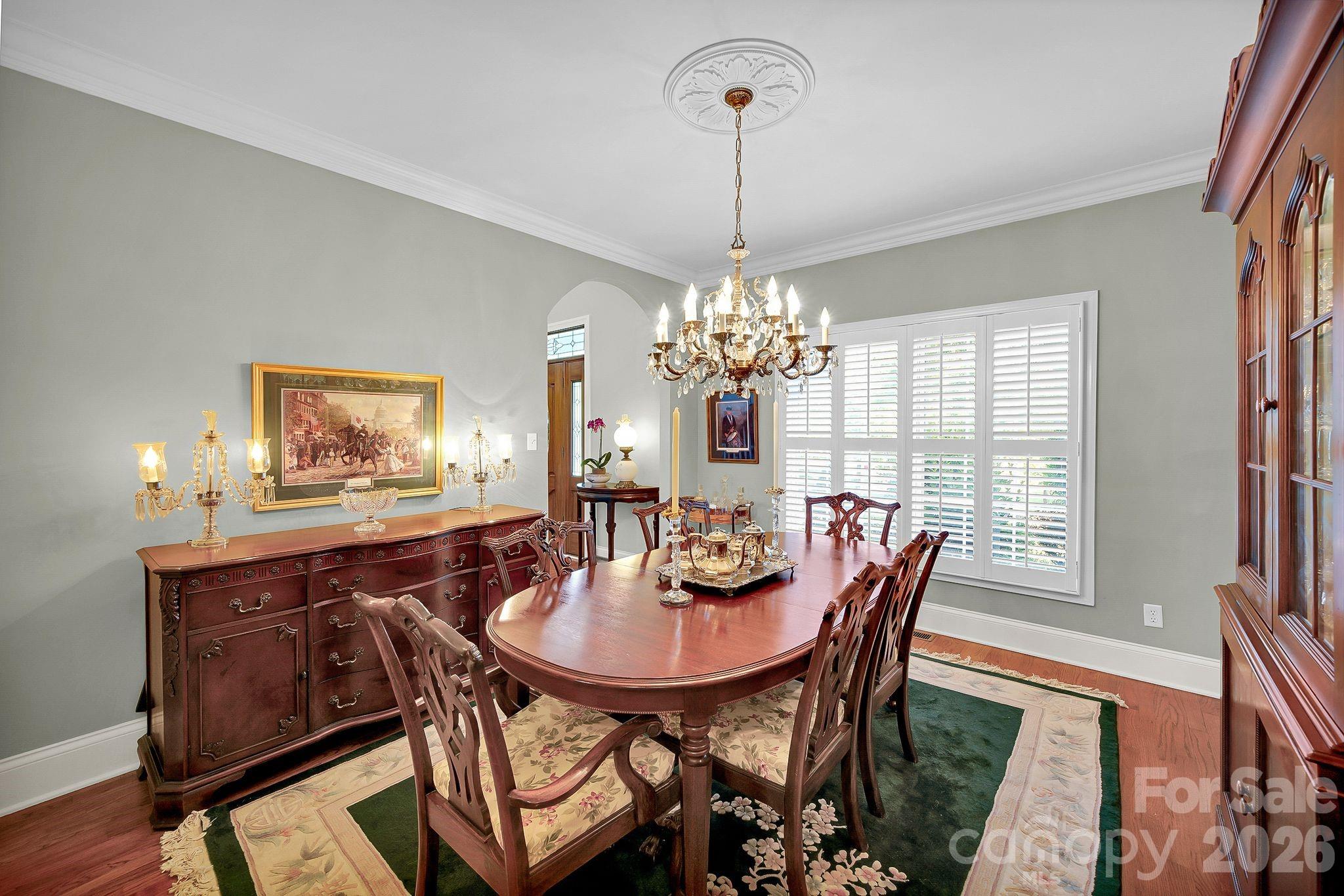 1171 State Rd S-29-376 Lancaster, SC 29720 - Photo 18 of 48 a dining room with furniture a chandelier and wooden floor