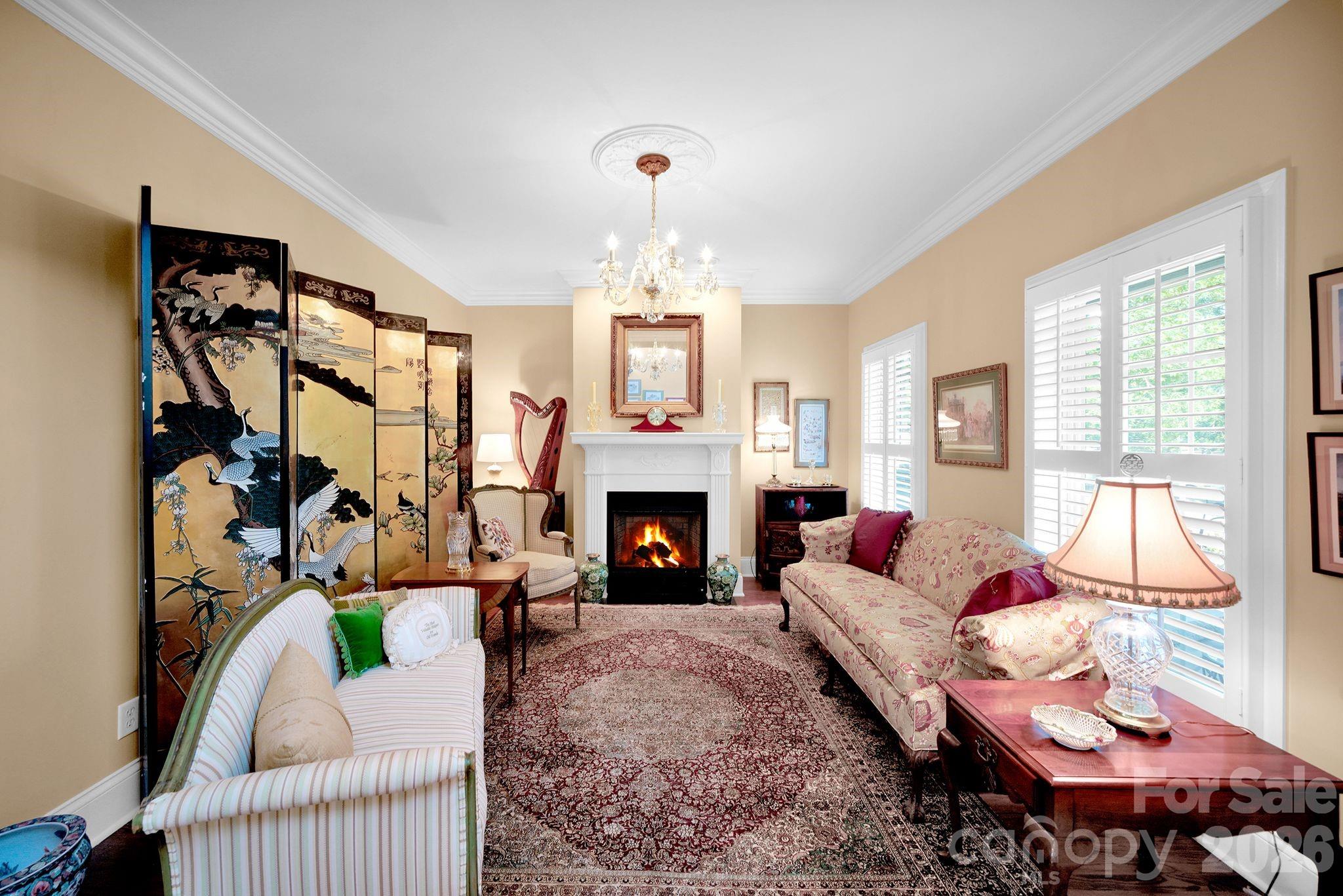 1171 State Rd S-29-376 Lancaster, SC 29720 - Photo 19 of 48 a living room with furniture a fireplace and a large window