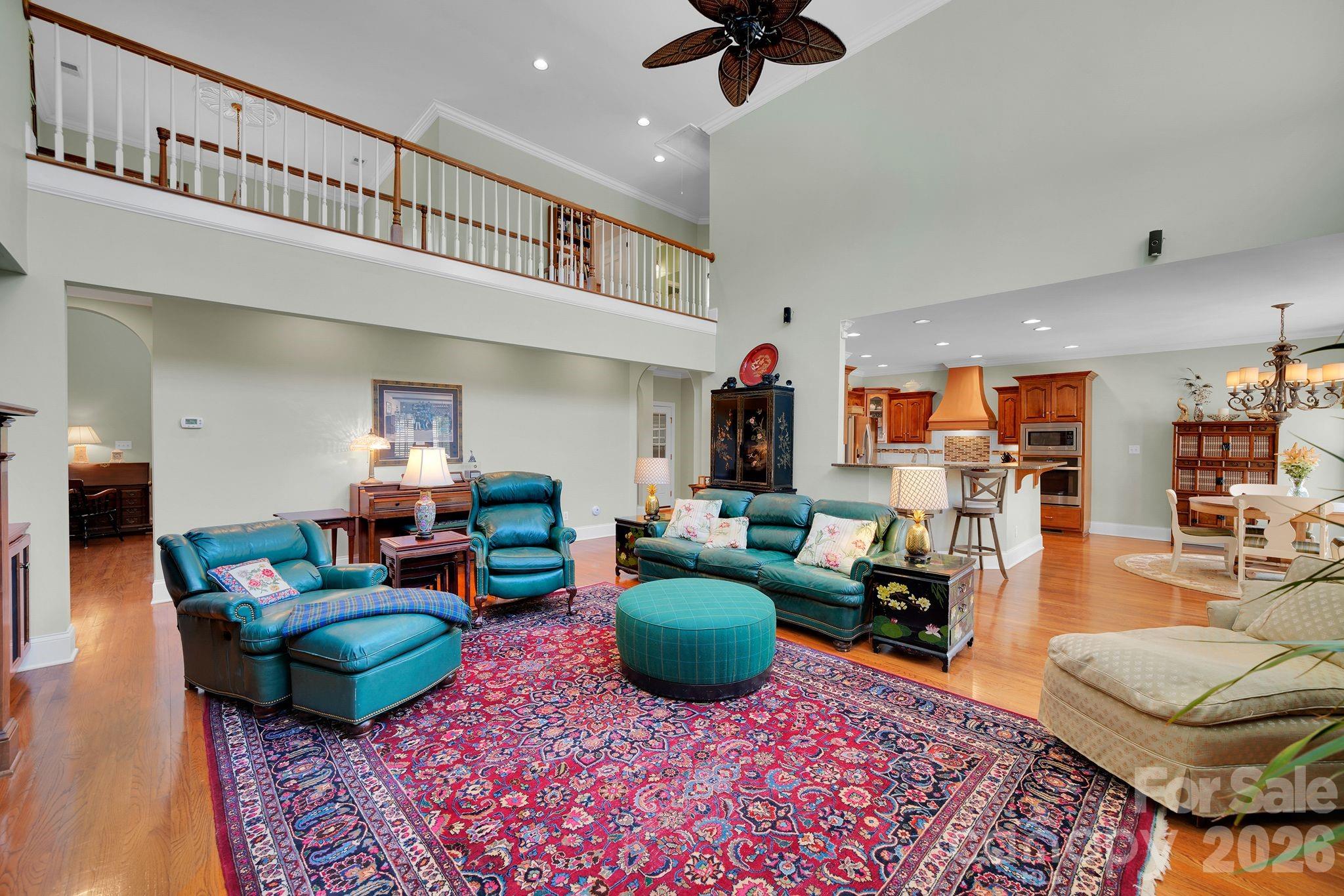 1171 State Rd S-29-376 Lancaster, SC 29720 - Photo 22 of 48 a living room with furniture a rug and a chandelier