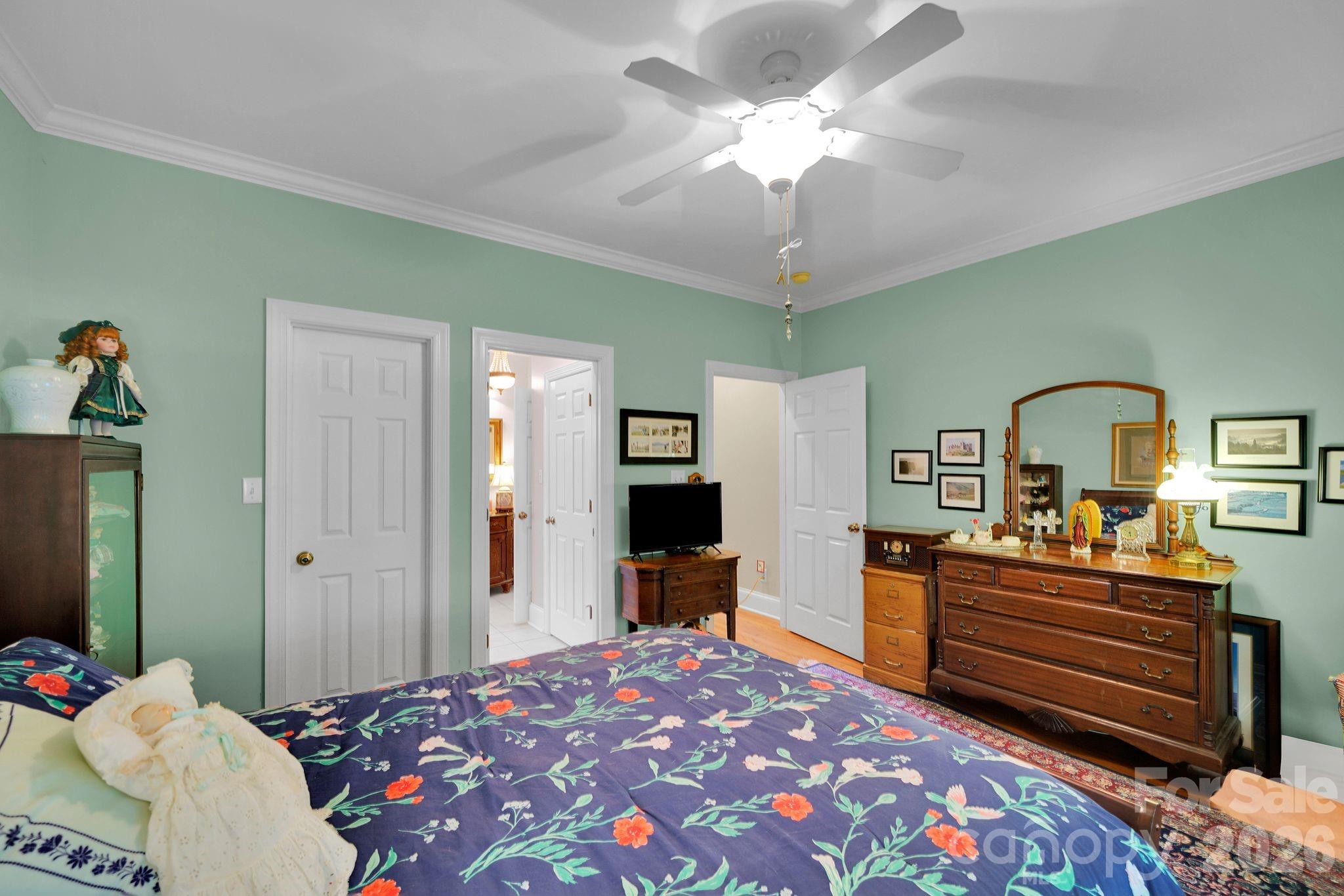 1171 State Rd S-29-376 Lancaster, SC 29720 - Photo 24 of 48 a bedroom with a bed and a chandelier