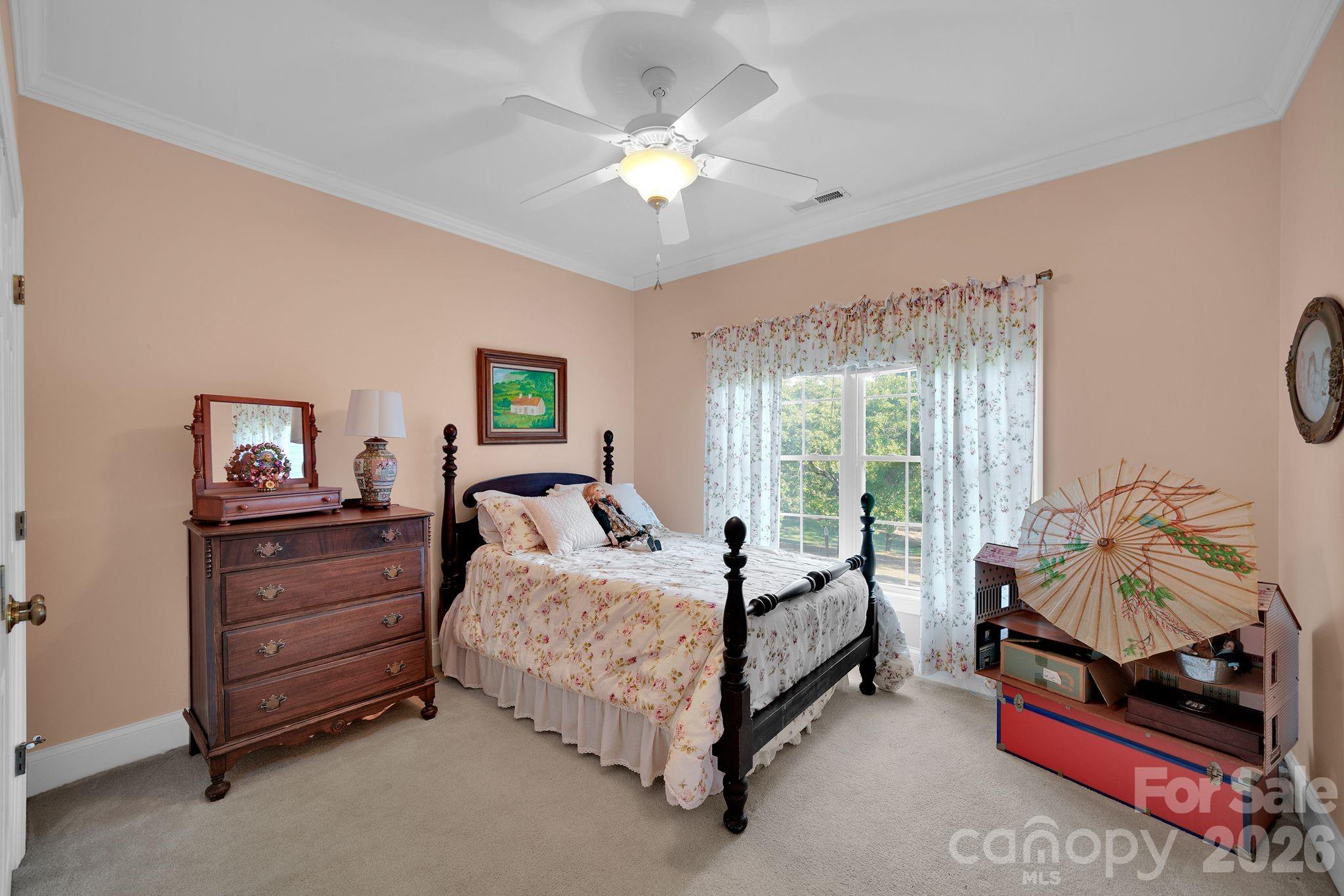 1171 State Rd S-29-376 Lancaster, SC 29720 - Photo 33 of 48 a bedroom with a bed and a chandelier
