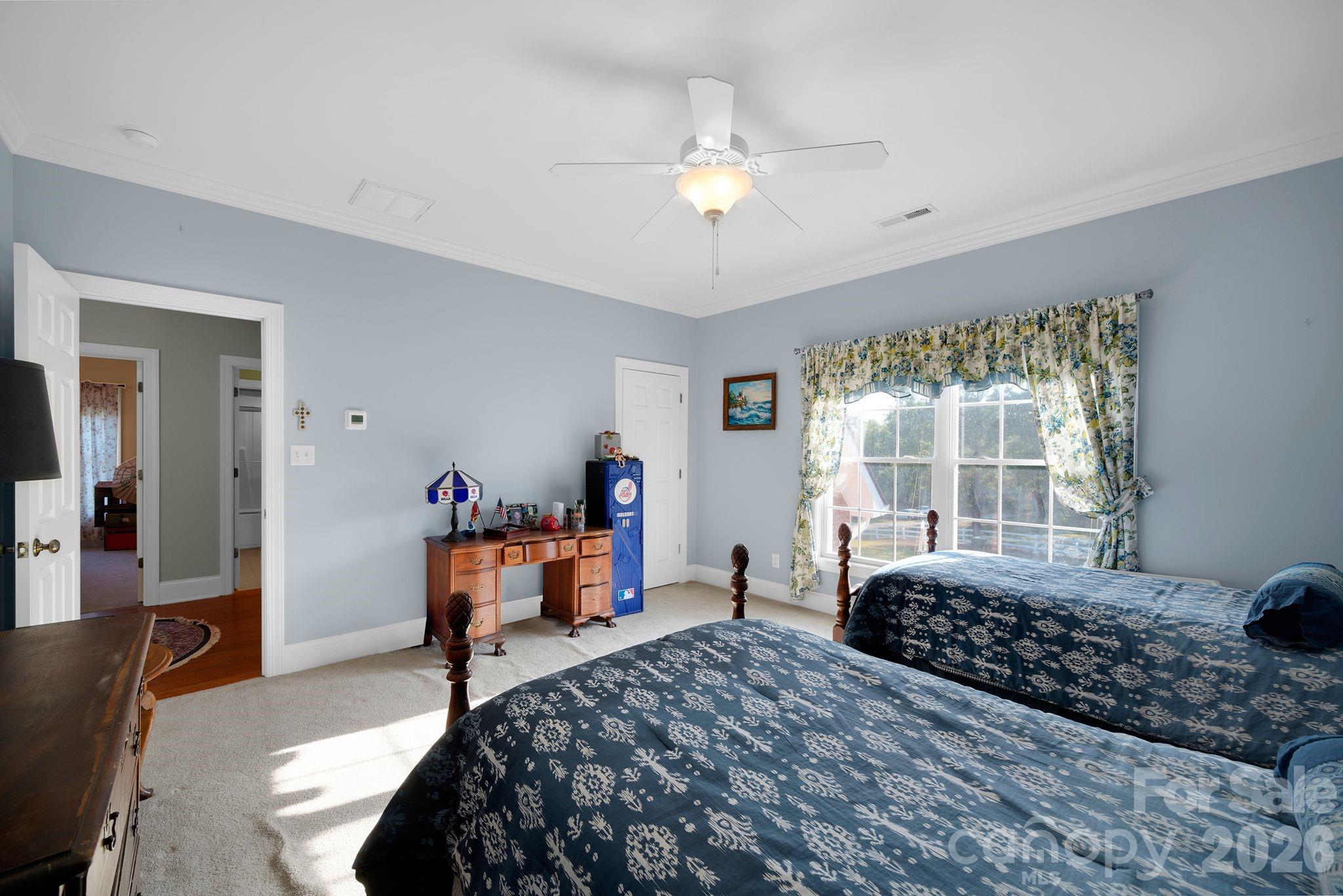 1171 State Rd S-29-376 Lancaster, SC 29720 - Photo 35 of 48 a bedroom with a bed and wooden floor