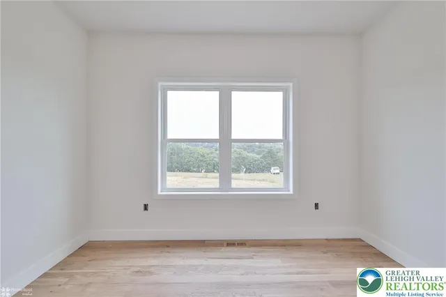 a view of an empty room and window
