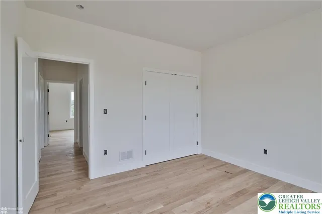 an aerial view of a house with a swimming pool